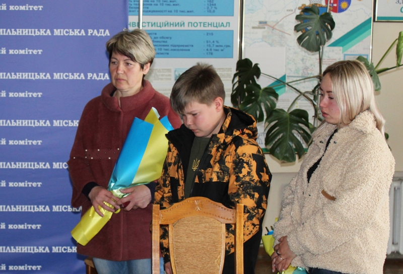 May be an image of 3 people and text